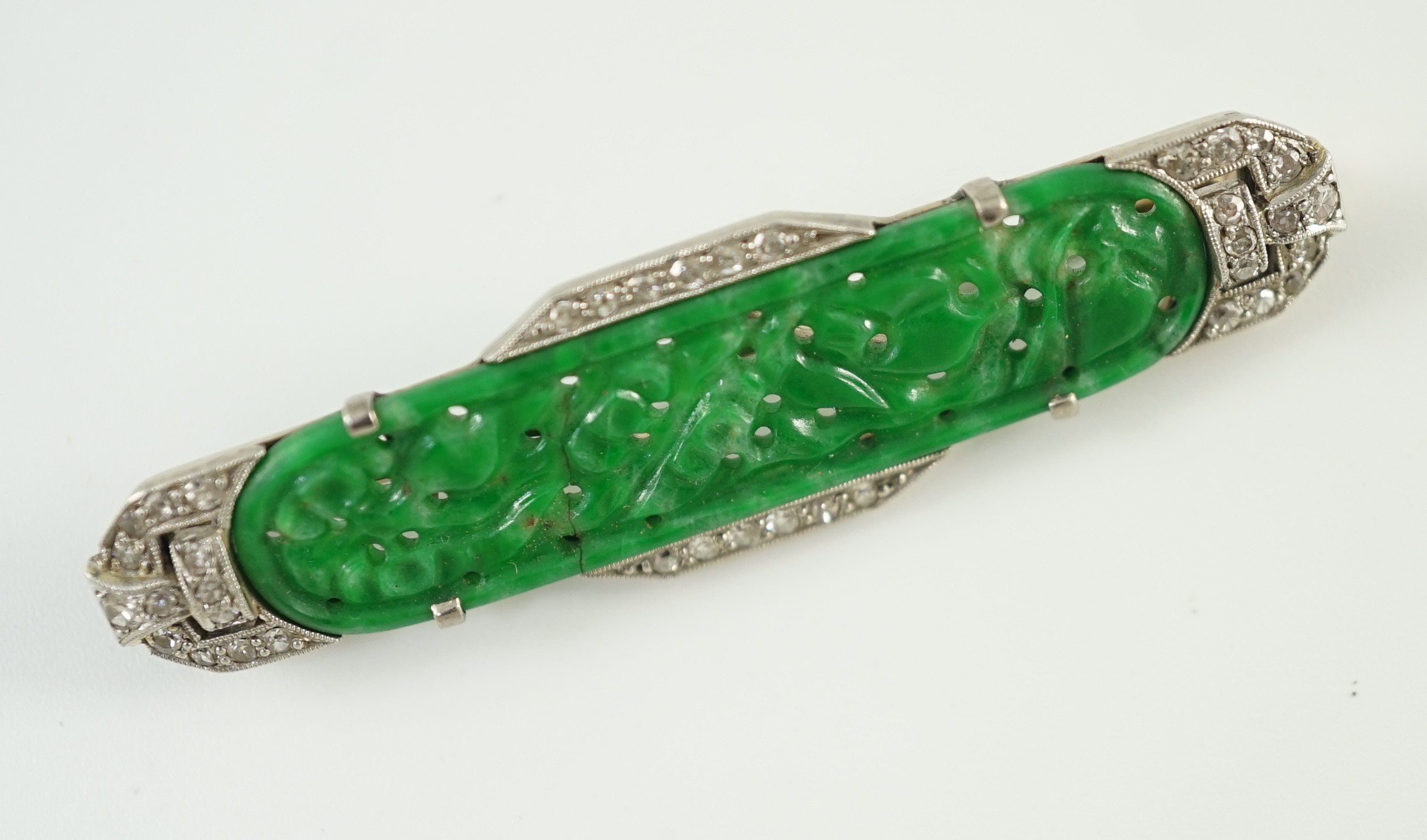 An Art Deco white gold, jadeite and diamond set bar brooch